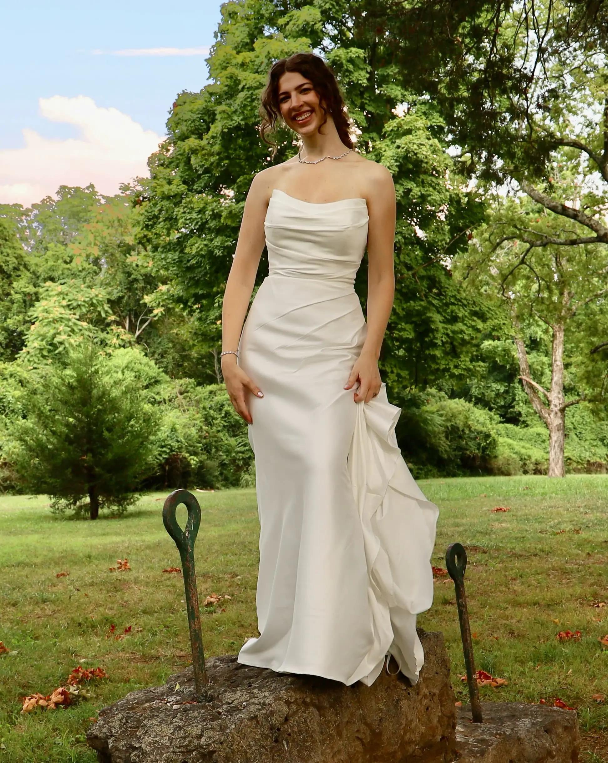 white wedding gown hanging on a hanger