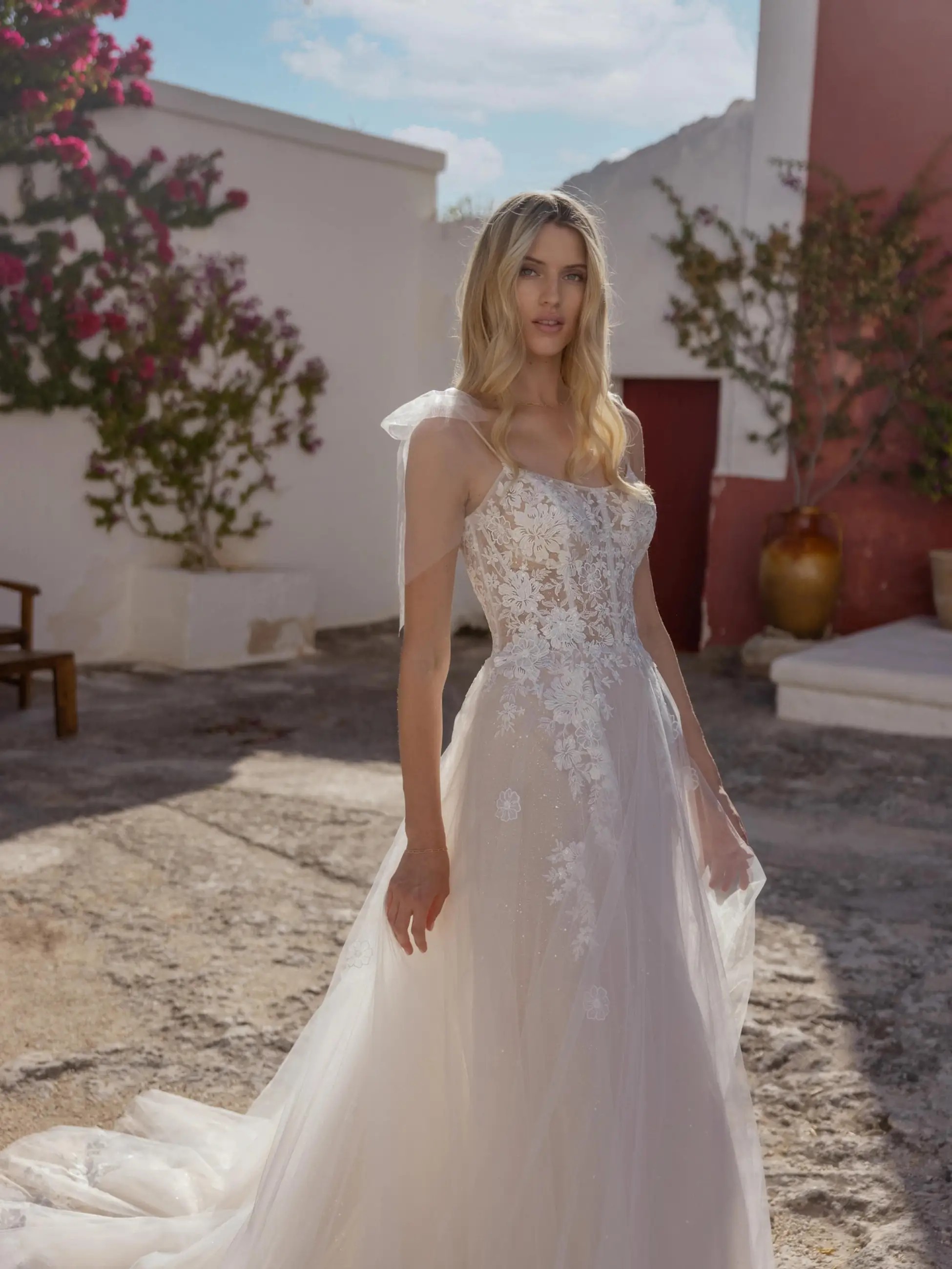 Photo of the model wearing a white bridal gown